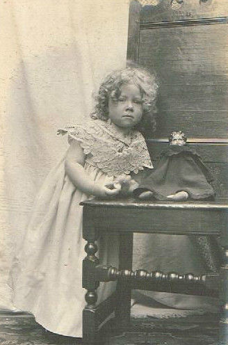 Antique photo English curly blonde girl with lowbrow china doll